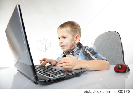 Computer addiction emotional boy with laptop Computer addiction emotional boy with laptop 9900170
