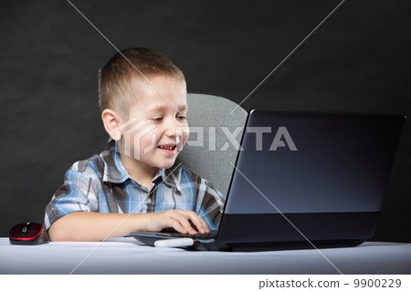 Computer addiction child with laptop notebook 9900229