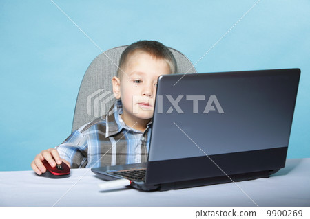 Computer addiction child with laptop notebook Computer addiction child with laptop notebook 9900269