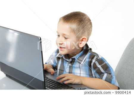 Computer addiction child with laptop notebook Computer addiction child with laptop notebook 9900414