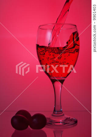 Pouring wine into a glass. 9901403