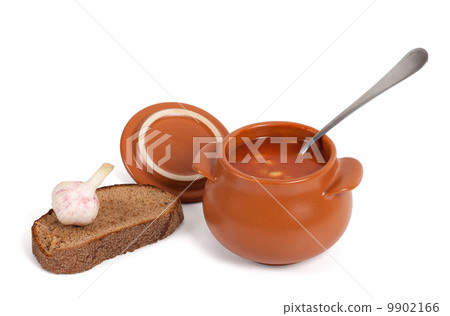 Borsch in clay pot with bread and garlic Borsch in clay pot with bread and garlic 9902166