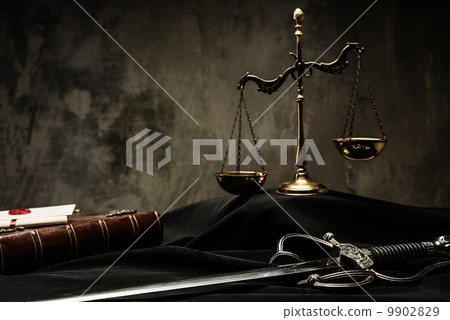 Scales, book and Sword of Justice on a judge's mantle Scales, book and Sword of Justice on a judge's mantle 9902829