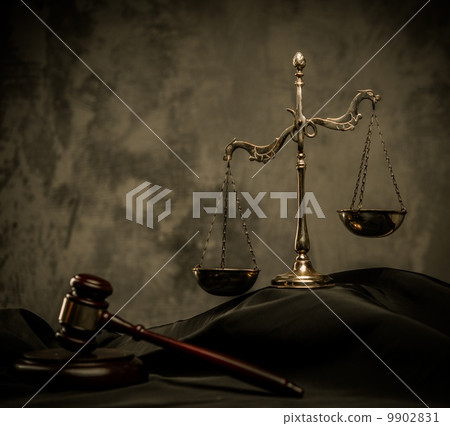 Scales and wooden hammer on judge's mantle Scales and wooden hammer on judge's mantle 9902831