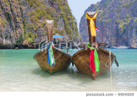 Longtail boats in the famous Maya bay of Phi-phi Leh island 9904889