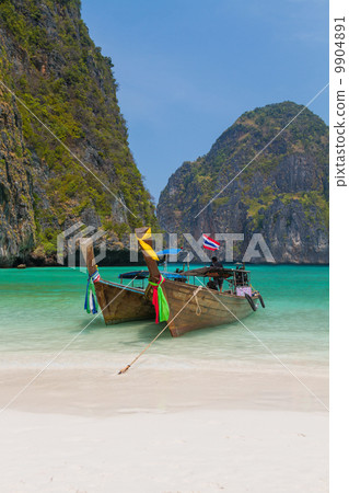 Longtail boats in the famous Maya bay of Phi-phi Leh island 9904891