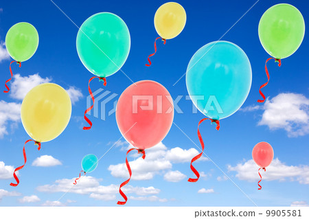 Balloons fly into the  sky 9905581