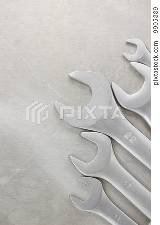 wrench on metal background 9905889