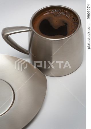 coffee in a modern metal cup 9906074