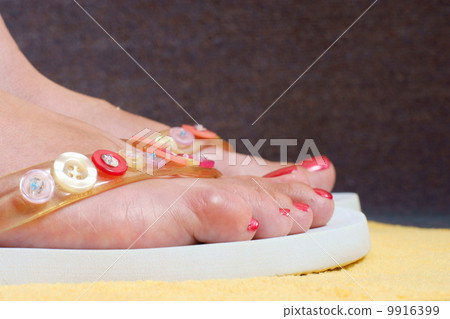 female feet and flip-flop 9916399