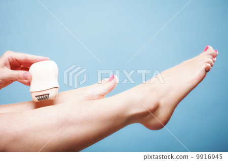 woman shaving leg with shaver depilation body care woman shaving leg with shaver depilation body care 9916945
