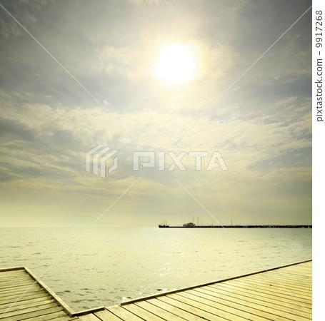 old wooden pier at the sea sunrise or sunset old wooden pier at the sea sunrise or sunset 9917268