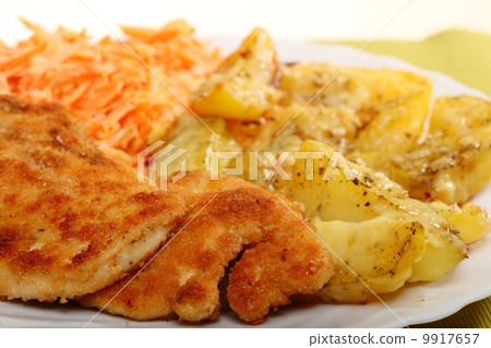 Fried chicken roasted potatos and carrot salad Fried chicken roasted potatos and carrot salad 9917657