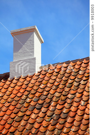old tiles red roof with himney sky background old tiles red roof with himney sky background 9918003