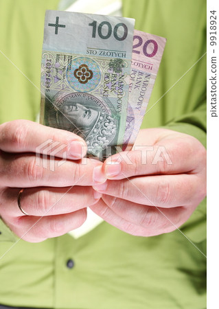 Businessman holding money 100 polish zloty 9918924
