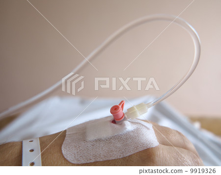 Patient's hand in the hospital with an IV Patient's hand in the hospital with an IV 9919326