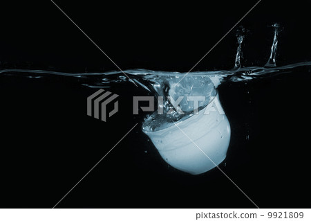 Coffee cup dropped into water 9921809