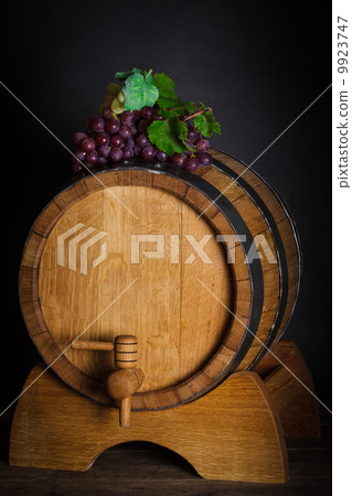 Grapes on wooden barrel Grapes on wooden barrel 9923747