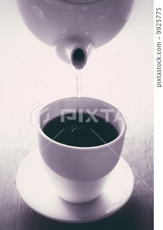 Hot tea on the wood background 9925775