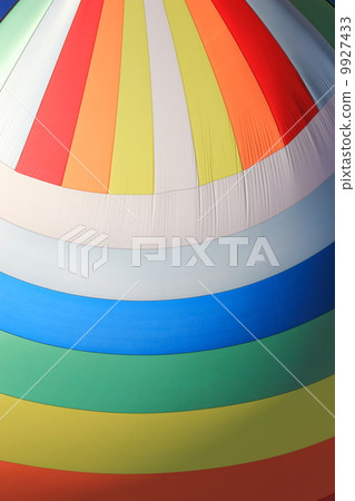 The wind has filled colorful spinnaker sail The wind has filled colorful spinnaker sail 9927433