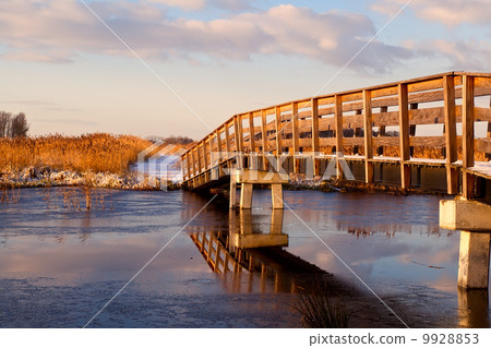 wooden bridge over river 9928853