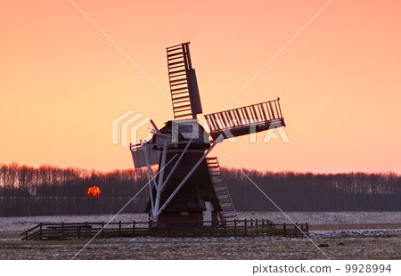 Charming Dutch windmill during sunset 9928994