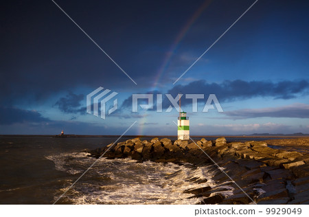 lighthouse and rainbow over sea lighthouse and rainbow over sea 9929049