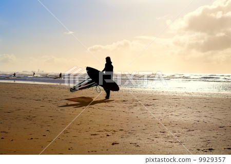 silhouette of kitesurfer on sand beach silhouette of kitesurfer on sand beach 9929357