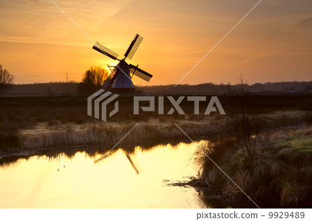 windmill silhouette at sunrise windmill silhouette at sunrise 9929489
