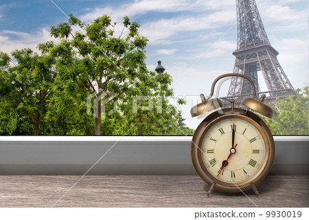 View of Paris and Eiffel tower from window with alarm clock 9930019