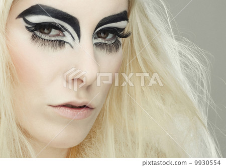 Beautiful blond girl with cat eyes make-up 9930554