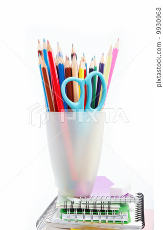 Stationery isolated. Color pencils and notebook on white backgro Stationery isolated. Color pencils and notebook on white backgro 9930968