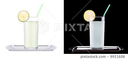 Delicious lemon juice in glass and limes 9931686