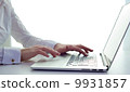 Business woman typing on a laptop 9931857