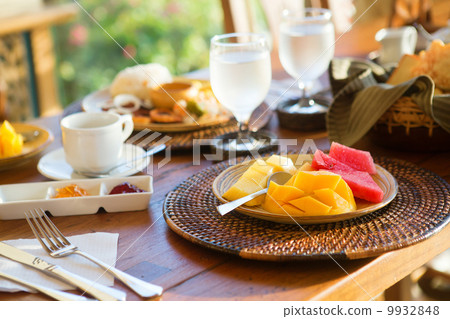 Delicious healthy breakfast with fruit selection and coffee Delicious healthy breakfast with fruit selection and coffee 9932848