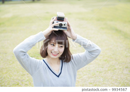Cute lady with polaroid camera Cute lady with polaroid camera 9934567