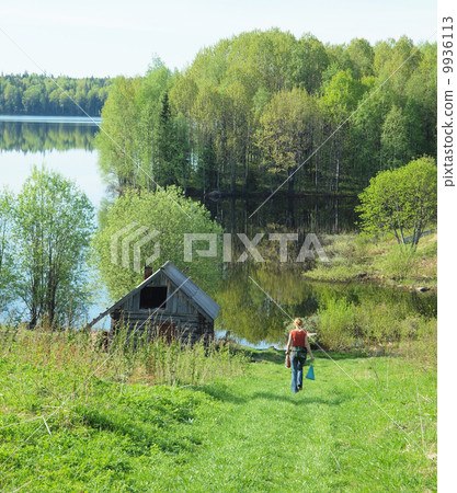 girl goes down to the river in the village girl goes down to the river in the village 9936113