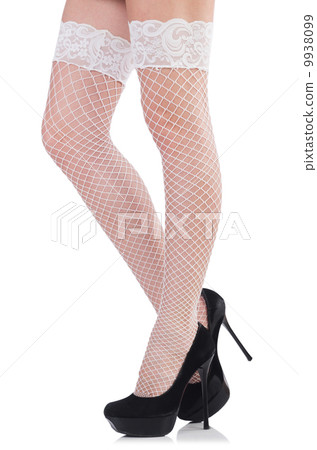 Woman legs with stockings on white Woman legs with stockings on white 9938099
