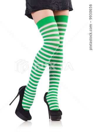 Woman legs with stockings on white 9938656