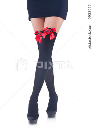 Woman legs with stockings on white Woman legs with stockings on white 9938963