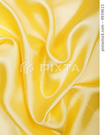 Smooth elegant golden silk as background Smooth elegant golden silk as background 9939613