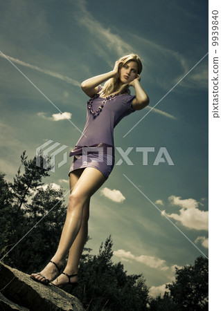blond girl in purple dress 9939840