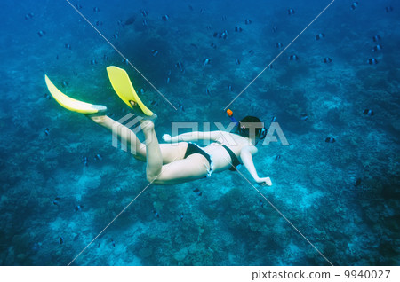 Woman with mask snorkeling Woman with mask snorkeling 9940027