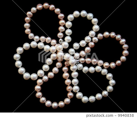 Flower of white and pink pearls on a black silk 9940838
