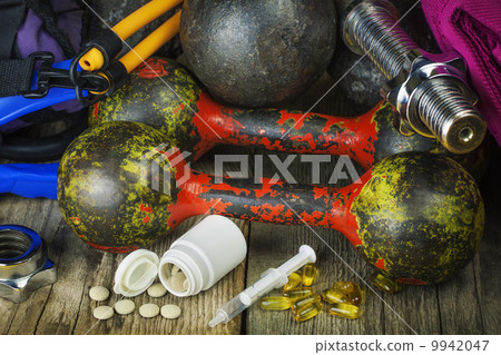 Dumbbells, sports gear with pills and medicines Dumbbells, sports gear with pills and medicines 9942047