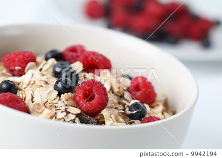 Granola with raspberries and blueberries 9942194