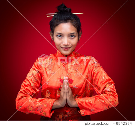 Asian woman greets 9942554