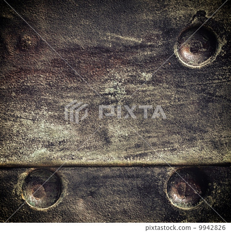 Grunge black metal plate with rivets screws background texture 9942826