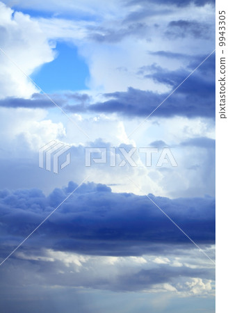 Deep blue sky with storm clouds before rain 9943305