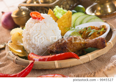 indonesian fried chicken rice on traditional background indonesian fried chicken rice on traditional background 9945527
